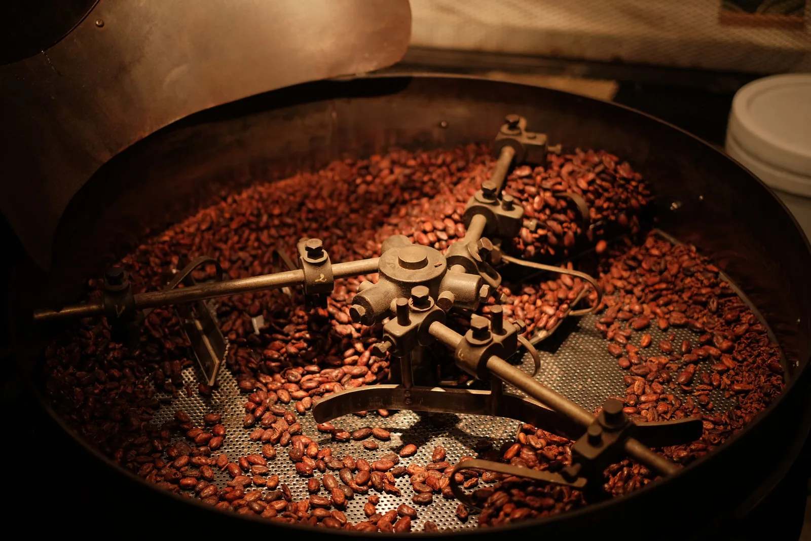 Coffee beans turning in the cooling tray of a drum roaster